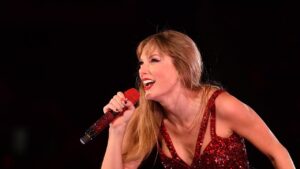 Taylor Swift Adorably Reacts to Record-Breaking GRAMMY Nominations On Stage
