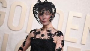 The Reason Behind 'Saltburn' Star Rosamund Pike's Bold Golden Globes Veil Revealed