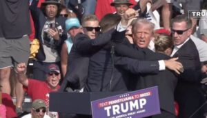 Donald Trump Rally Erupts In Gunfire As Secret Service Rush Stage, Xitter Thinks Shooting Was Staged