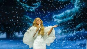 Mariah Carey Autographs Rihanna’s Billionaire Boob At Concert