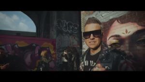 Watch Robbie Williams and Tony Iommi discuss collaboration in behind-the-scenes footage of ‘Rocket’ music video